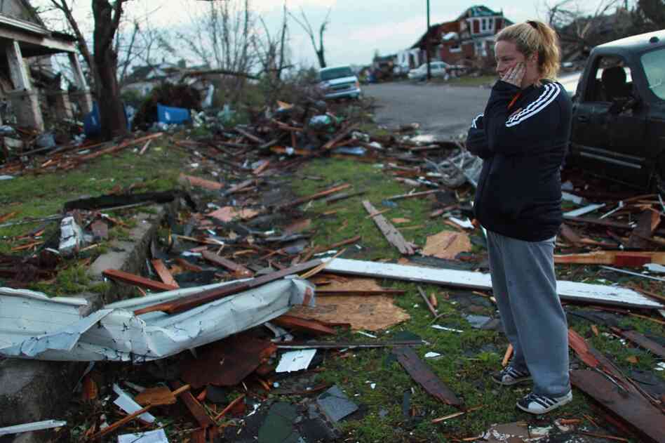 Carra Reed looks at a friend's home that was destroyed in Joplin. 