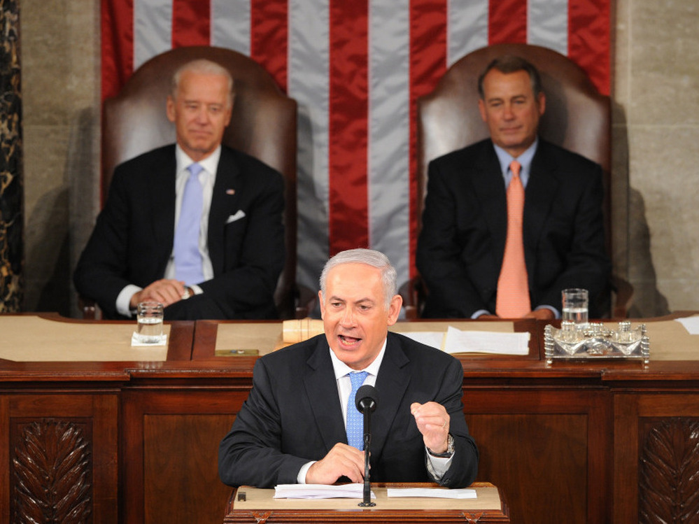 Vice President Joe Biden and House Speaker John Boehner watch as Israeli Prime Minister Benjamin Netanyahu addresses lawmakers at the Capitol on Tuesday.