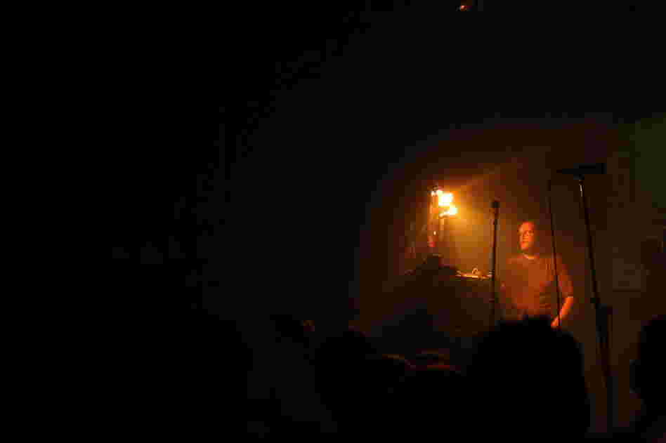 Dan Deacon begins his tribute to the insane energy of Butthole Surfers shows by cutting the stage lights. 
