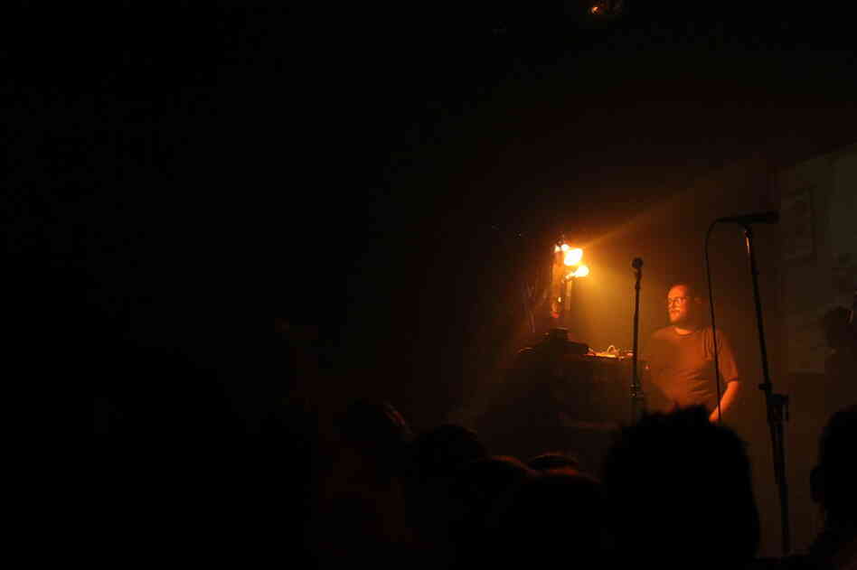 Dan Deacon begins his tribute to the insane energy of Butthole Surfers shows by cutting the stage lights. 