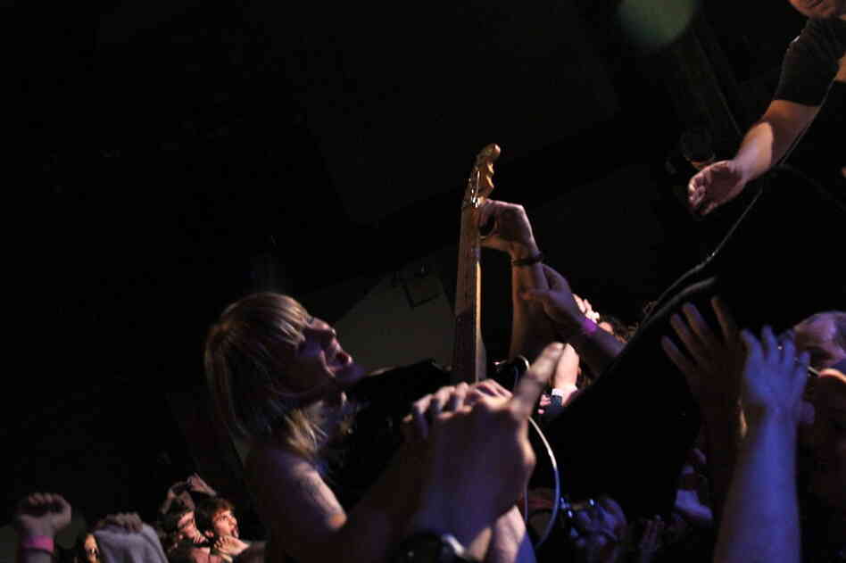Wye Oak's Jenn Wasner tumbles into the crowd during the closing all-star Nirvana jam. 