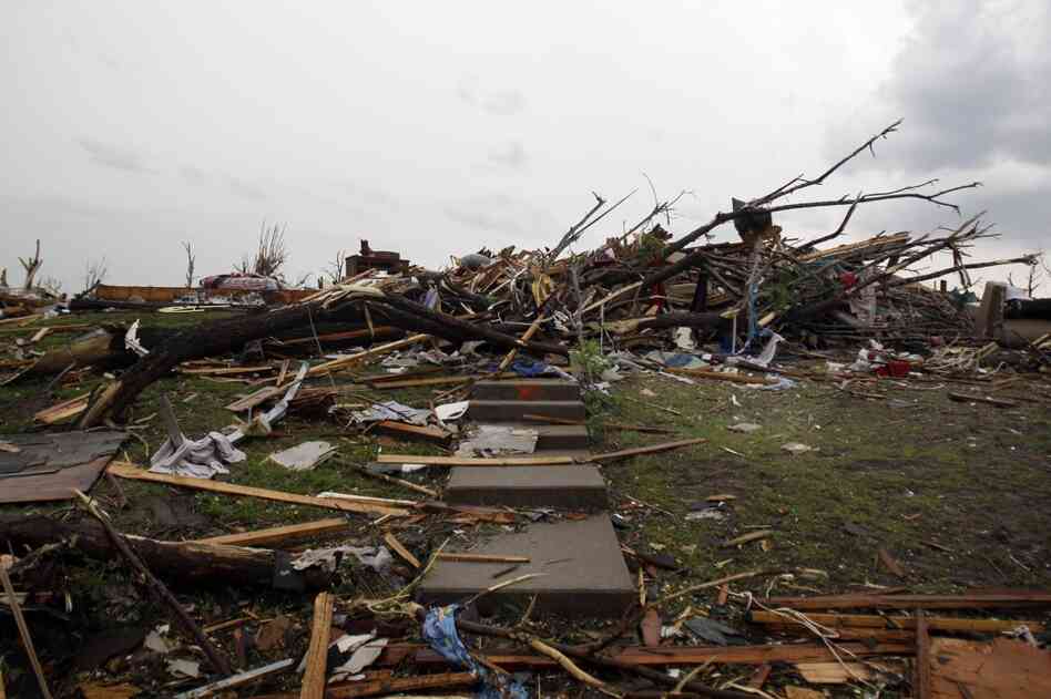 Stairs lead to rubble where a home once stood. 