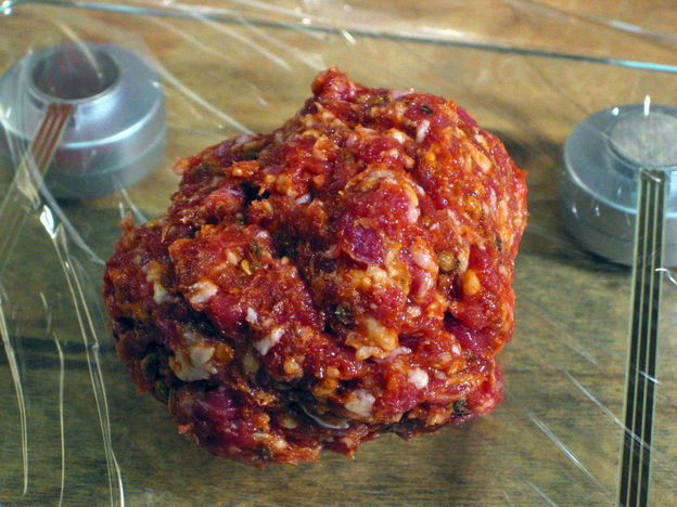 Of course fresh Italian sausage can be stuffed into a casing, but another option is to portion it into patties, fry it and serve it on a bun.
