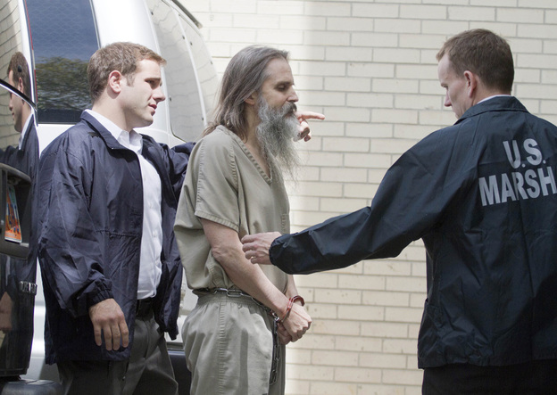 Brian David Mitchell is escorted into the Frank E. Moss Federal Courthouse in Salt Lake City.