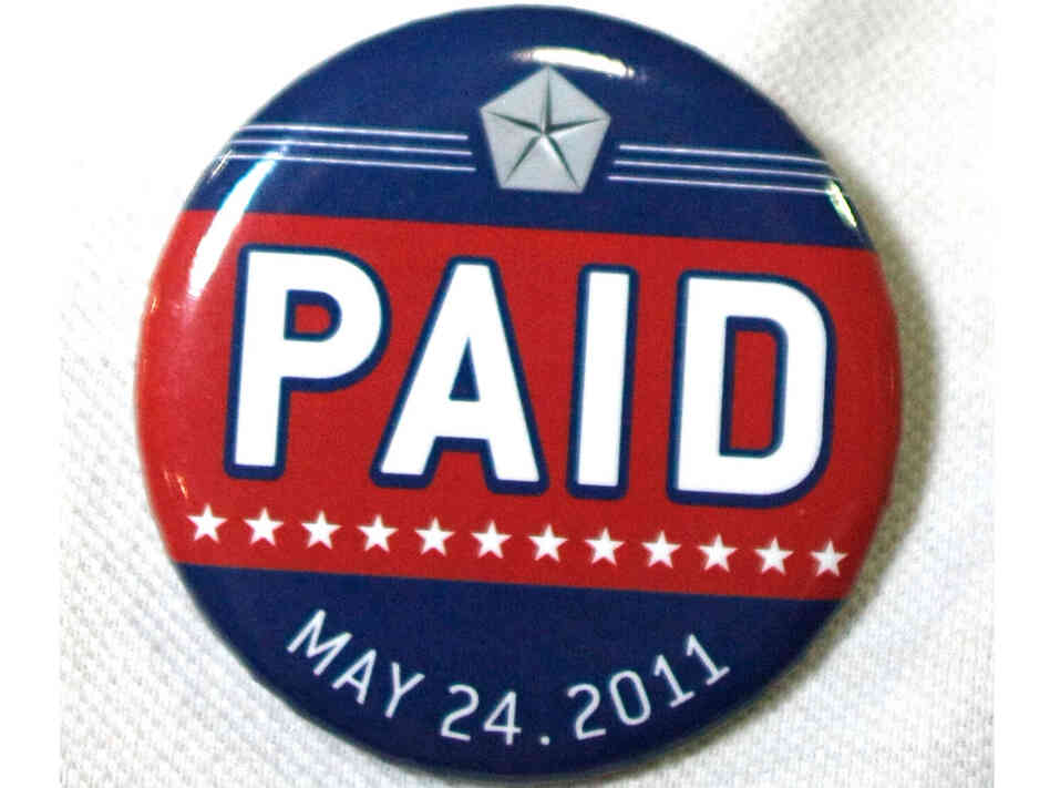 An assembly line worker wears a pin labled "PAID" on his shirt before Chrysler Group and Fiat SpA CEO Sergio Marchionne announces the repayment of the remaining $5.9 billion of Chrysler's $10.5 billion loan from the U.S. Government. In our second hour, guests examine whether or not the auto bailout was worth the effort. An assembly line worker wears a pin labled "PAID" on his shirt before Chrysler Group and Fiat SpA CEO Sergio Marchionne announces the repayment of the remaining $5.9 billion of Chrysler's $10.5 billion loan from the U.S. Government. In our second hour, guests examine whether or not the auto bailout was worth the effort.