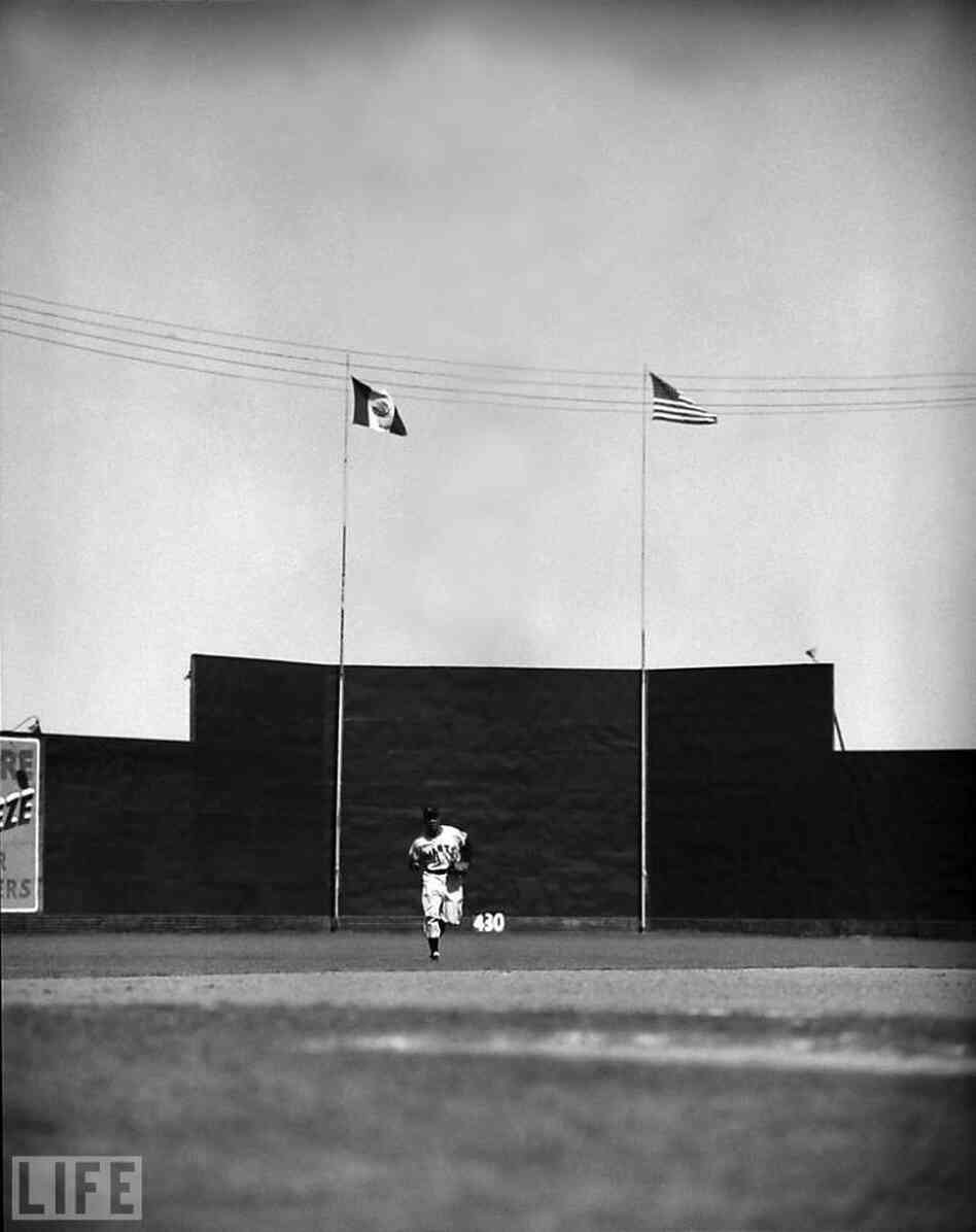Mays jogs in from center field, 1954 Mays jogs in from center field, 1954
