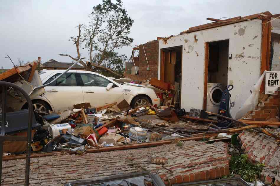A car sits in what used to be the garage of a home in Piedmont. 