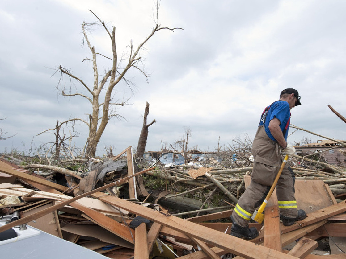 Jason Martin of the Carthage Fire Department made his way through debris during a search and rescue mission Tuesday (May 24, 2011) in Joplin.