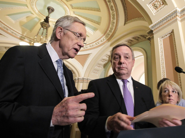Senate Majority Leader Harry Reid (D-NV) is joined by Majority Whip Dick Durbin (D-IL) and Sen. Patty Murray (D-WA) as he speaks to reporters after a budget vote Wednesday. The Democratic-run Senate voted down a controversial budget plan from the Republican-majority House that calls for turning Medicare into a voucherlike program for future beneficiaries.