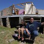 Amy Womack and her daughter, Alexis Nelson, sit on the front steps of her parents' house in Cleveland, Tenn., in late April. Womack says her father urged her and 13 relatives and friends into the basement before a tornado hit; she credits him with saving their lives. Amy Womack and her daughter, Alexis Nelson, sit on the front steps of her parents' house in Cleveland, Tenn., in late April. Womack says her father urged her and 13 relatives and friends into the basement before a tornado hit; she credits him with saving their lives.