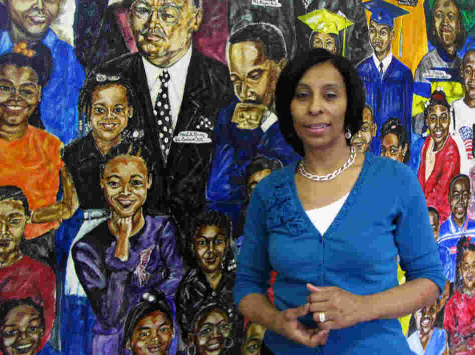 Janice Richardson, principal of Carstens Elementary School, stands in front of a mural in the school's entryway. The Detroit Public School system is losing thousands of students, and Carstens may have to close or become a charter. Janice Richardson, principal of Carstens Elementary School, stands in front of a mural in the school's entryway. The Detroit Public School system is losing thousands of students, and Carstens may have to close or become a charter.