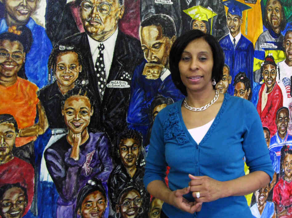 Janice Richardson, principal of Carstens Elementary School, stands in front of a mural in the school's entryway. The Detroit Public School system is losing thousands of students, and Carstens may have to close or become a charter. Janice Richardson, principal of Carstens Elementary School, stands in front of a mural in the school's entryway. The Detroit Public School system is losing thousands of students, and Carstens may have to close or become a charter.