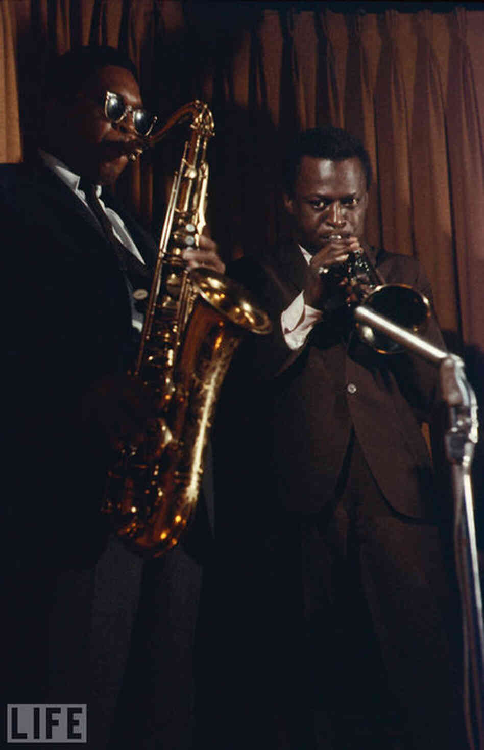 John Coltrane (left) and Miles Davis.