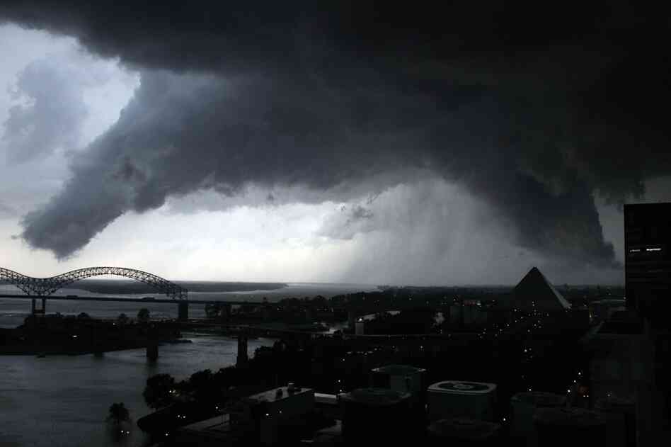 A line of severe storms crosses the Mississippi River in Memphis, Tenn., on Wednesday. The dark formation was reported a few minutes earlier as a tornado in West Memphis, Ark. 