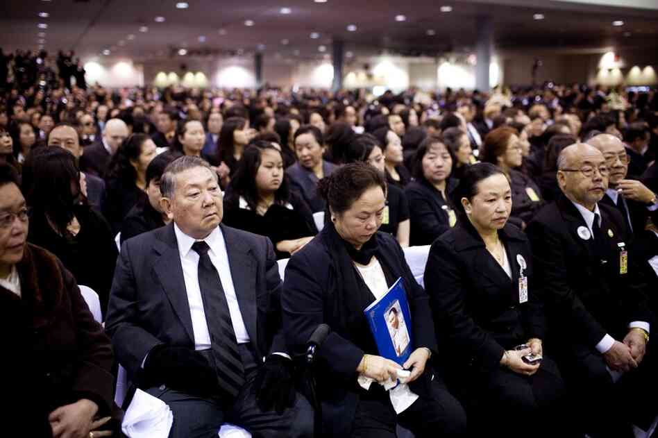 Family, friends and members of the Hmong community crowd the Fresno Convention Center for the funeral.