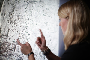 Sarah Parcak examines satellite imagery of an Egyptian landscape. Sarah Parcak examines satellite imagery of an Egyptian landscape.