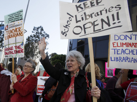 Teachers and librarians demonstrate against thousands of proposed job cuts in the Los Angeles Unified School District Tuesday.