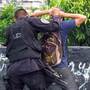 Members of the Salvadoran police squad "The Hawks" search suspected gang members in San Salvador.