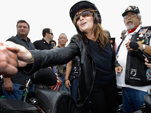 Former Alaska Gov. and GOP vice presidential nominee Sarah Palin greets some of the thousands of motorcycle enthusiasts and military veterans participating in the Rolling Thunder rally on Sunday. Former Alaska Gov. and GOP vice presidential nominee Sarah Palin greets some of the thousands of motorcycle enthusiasts and military veterans participating in the Rolling Thunder rally on Sunday.