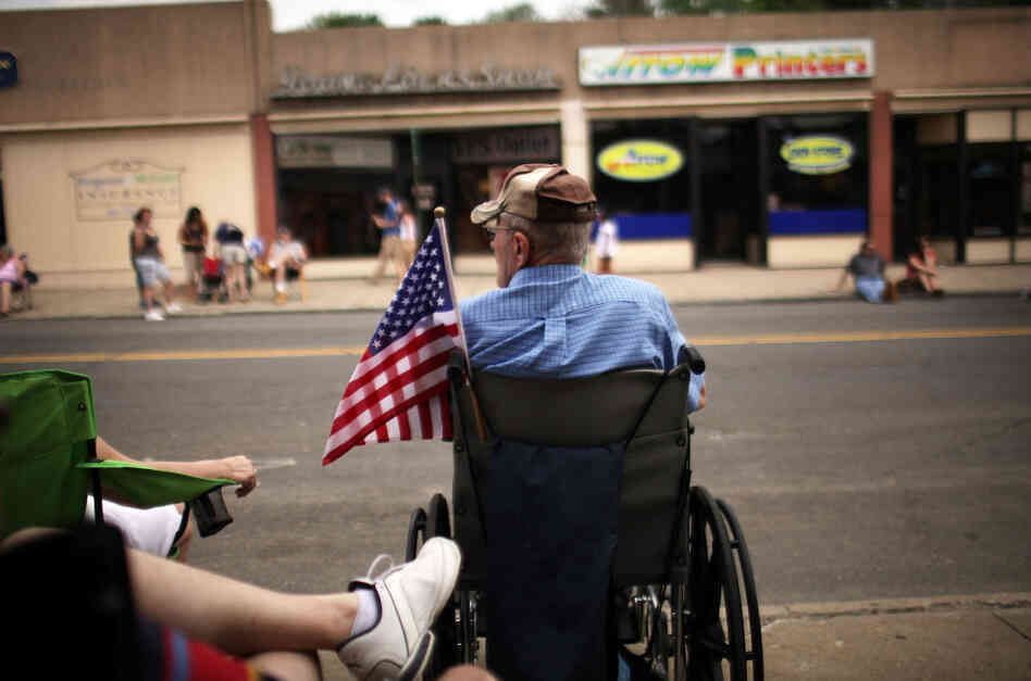 People wait for the start of the Memorial Day Parade in Ansonia, Conn. People wait for the start of the Memorial Day Parade in Ansonia, Conn.