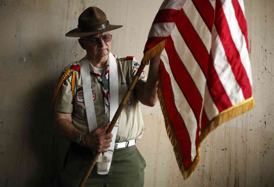 Richard Marsden with Boy Scout Troop 226 prepares an American flag before a Memorial Day parade in Philadelphia on Monday. Richard Marsden with Boy Scout Troop 226 prepares an American flag before a Memorial Day parade in Philadelphia on Monday.