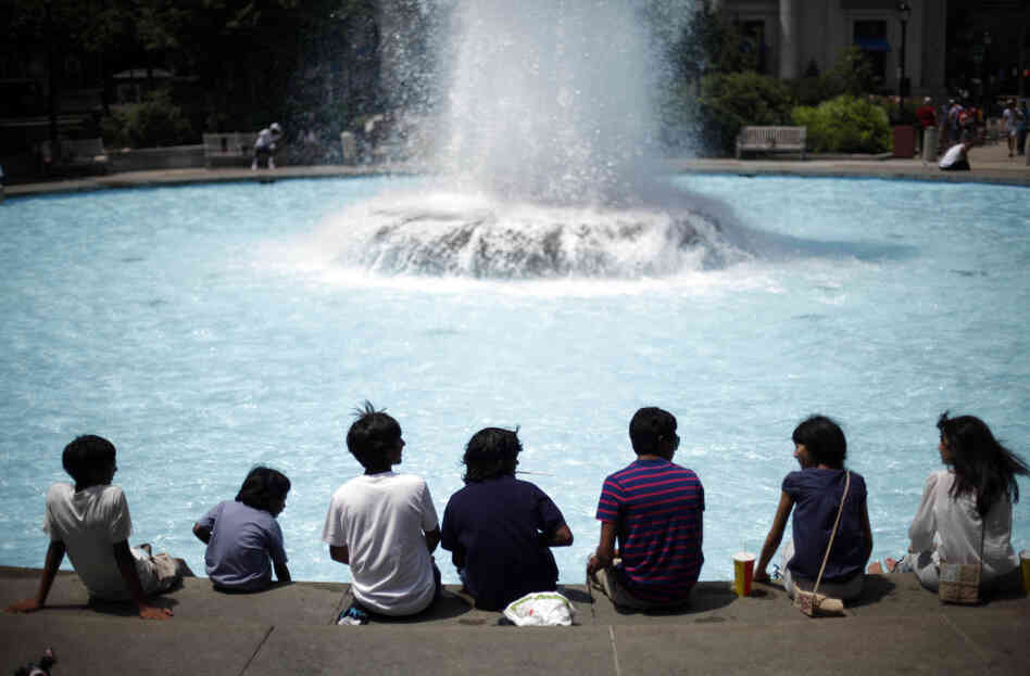 People cool off at John F. Kennedy Plaza, also known as Love Park, in Philadelphia on Monday. People cool off at John F. Kennedy Plaza, also known as Love Park, in Philadelphia on Monday.