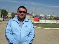 Nurlan Akhmetalin, 38, stands in front of a Chinese-owned oil processing facility near Aktobe, Kazakhstan. Now a cab driver, he worked for the China National Petroleum Corp. from 1996 to 2009. He made good money, but became less comfortable with how he says Chinese bosses treated employees and suspicious of China's intentions in his country.
