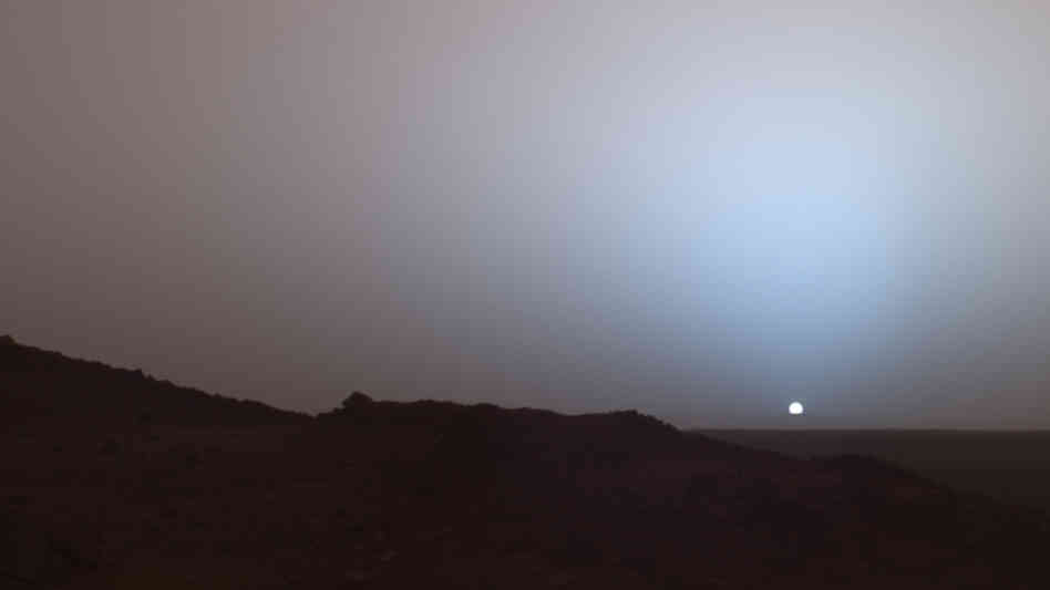 Spirit's camera captures sunset over Mars' Gusev Crater on May 19, 2005. Spirit's camera captures sunset over Mars' Gusev Crater on May 19, 2005.