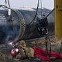 A worker welds at the China-Kazakhstan pipeline junction in Xinjiang, China, in 2008.