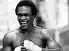 Welterweight boxer Sugar Ray Leonard, pictured above in August 1979, laughs as he tapes his hands before a workout in the boxing ring at the community center in Capitol Heights, Md.