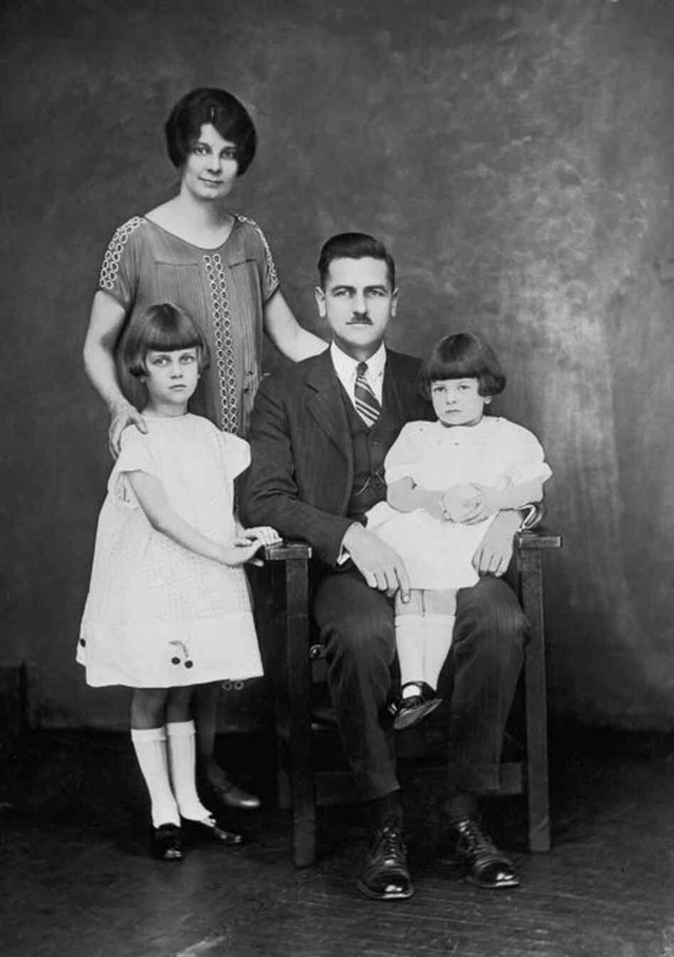 A family competing in the "small family class" in a fitter families contest poses at an Eastern States Exposition.