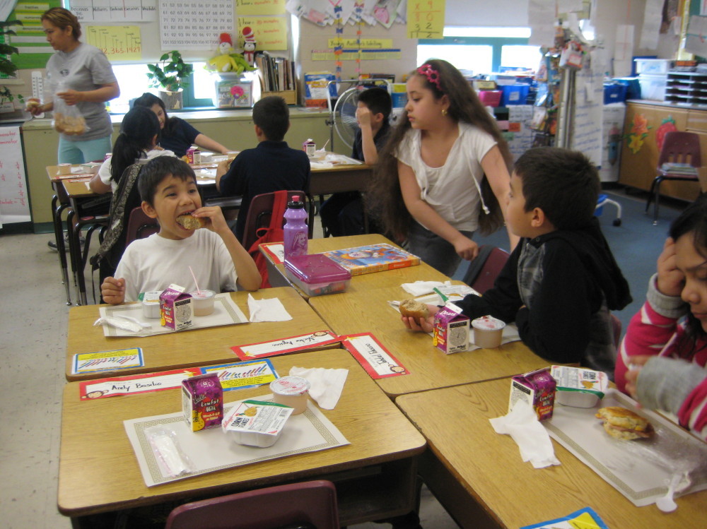 Students eat breakfast in the classroom at McAuliffe  Elementary on Chicago's northwest side. The school implemented the Breakfast in the Classroom program voluntarily three  years ago.