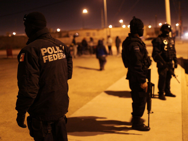 Mexican police at the scene of a drug-related shootout in Juarez on March 21,  2010.