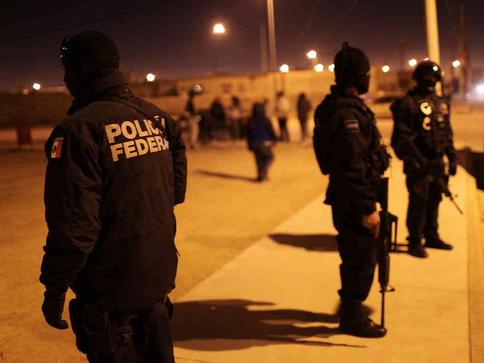 Mexican police at the scene of a drug-related shootout in Juarez on March 21,  2010.