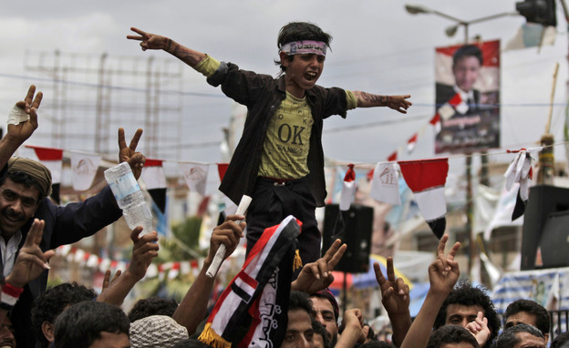 Anti-government protestors shout slogans during a demonstration demanding the resignation of Yemeni President Ali Abdullah Saleh, in Sanaa, Yemen on Thursday.