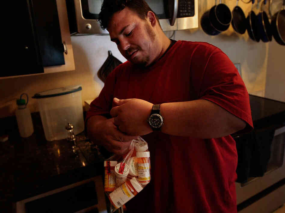 Bradley Hammond carries the many medications for mental health issues prescribed to him by doctors September 8, 2009 in in Denver, Colorado. Hammond struggles with Post Traumatic Stress Disorder after his experiences in Iraq. Two mental health researchers talk about PTSD in today's first hour. Bradley Hammond carries the many medications for mental health issues prescribed to him by doctors September 8, 2009 in in Denver, Colorado. Hammond struggles with Post Traumatic Stress Disorder after his experiences in Iraq. Two mental health researchers talk about PTSD in today's first hour.