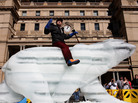 The "Sydney Ice Bear" on Friday in Sydney, Australia. The bear was carved by British artist Mark Coreth from a 10-ton block of ice. The public will be welcomed to touch the bear, leaving imprints that will begin the melting process and act as a metaphor for how humans affect the environment. The "Sydney Ice Bear" on Friday in Sydney, Australia. The bear was carved by British artist Mark Coreth from a 10-ton block of ice. The public will be welcomed to touch the bear, leaving imprints that will begin the melting process and act as a metaphor for how humans affect the environment.