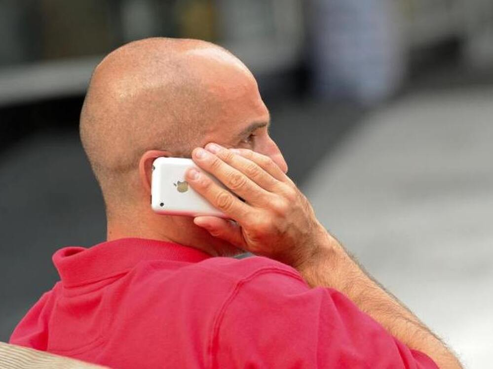 A Washington man talking on his cellphone may be taking a health risk, according to an analysis from the World Health Organization that finds a possible risk of cancer from exposure to the devices.