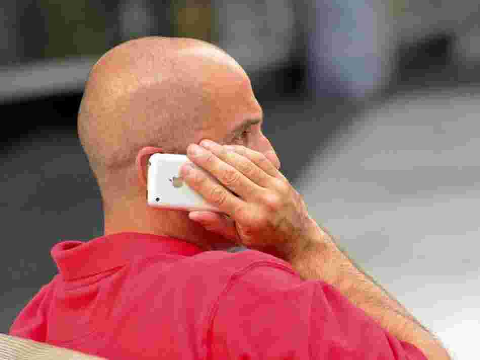 A Washington man talking on his cellphone may be taking a health risk, according to an analysis from the World Health Organization that finds a possible risk of cancer from exposure to the devices.