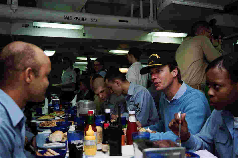 Then-Sen. Edwards dined with sailors from North Carolina aboard the aircraft carrier USS Theodore Roosevelt in the Arabian Sea, Jan. 9, 2002. 