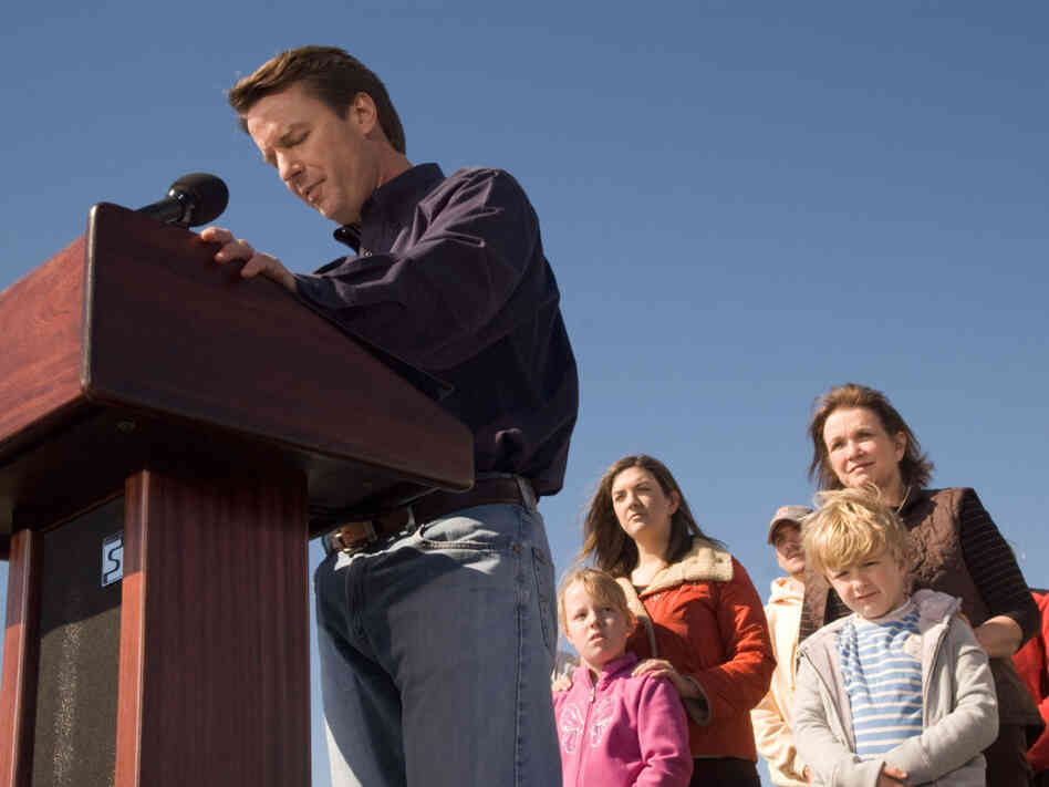 John Edwards exits the 2008 presidential race as his family watches, Jan. 30, 2008.
