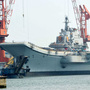 The Varyag aircraft carrier, shown April 26, is being renovated at a shipyard in the northern Chinese city of Dalian. After years of refurbishing work, the carrier — bought from Ukraine — has been described as "on the verge of setting out" by Xinhua state news agency. The Varyag aircraft carrier, shown April 26, is being renovated at a shipyard in the northern Chinese city of Dalian. After years of refurbishing work, the carrier — bought from Ukraine — has been described as "on the verge of setting out" by Xinhua state news agency.