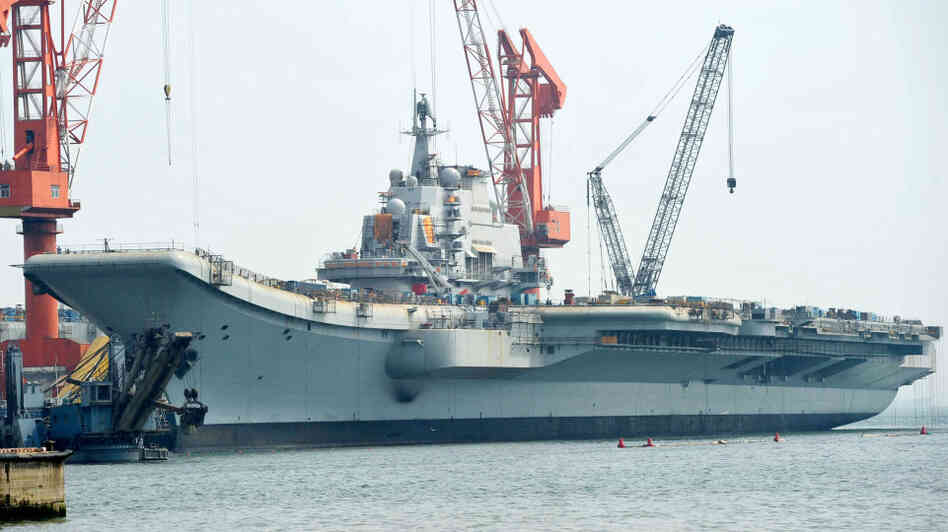 The Varyag aircraft carrier, shown April 26, is being renovated at a shipyard in the northern Chinese city of Dalian. After years of refurbishing work, the carrier — bought from Ukraine — has been described as "on the verge of setting out" by Xinhua state news agency.