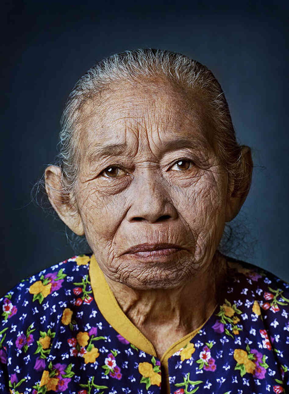 Ronasih, born 1931, Serang, West JavaAs a 13-year-old girl, Ronashi was picked up on her way home from school by a soldier and locked up in nearby barracks where he raped her routinely for months. Immediately after the war she underwent surgery for her internal injuries. ... She's been married five times, divorced several times after just a few months and has never been able to bear chil...