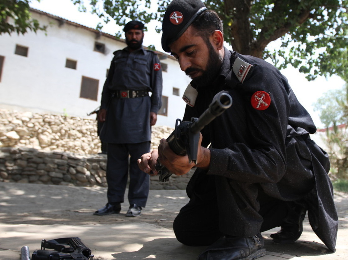 Frontier Constabulary troops return to Shabqadar Fort regularly for refresher courses on weapons and tactics. This man is assembling and disassembling a rifle under the watchful eye of his instructor.