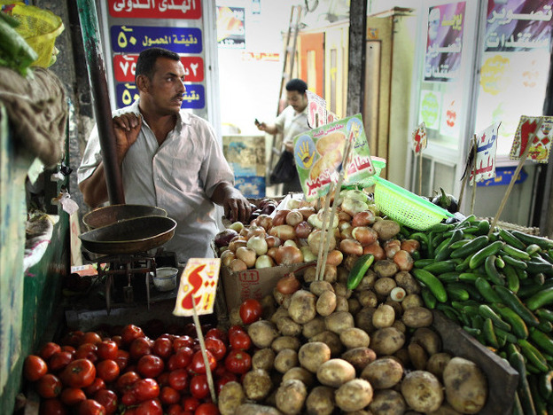A vegetable seller waits for customers at Ataba market in Cairo. Tourism has dropped since the revolution that removed President Hosni Mubarak from office, and Egypt's economy is sagging.