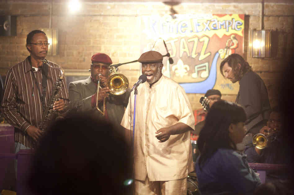 Al "Carnival Time" Johnson (center, singing) sits in with Antoine Batiste and the Soul Apostles on Treme. Batiste, the trombonist, is played by Wendell Pierce.