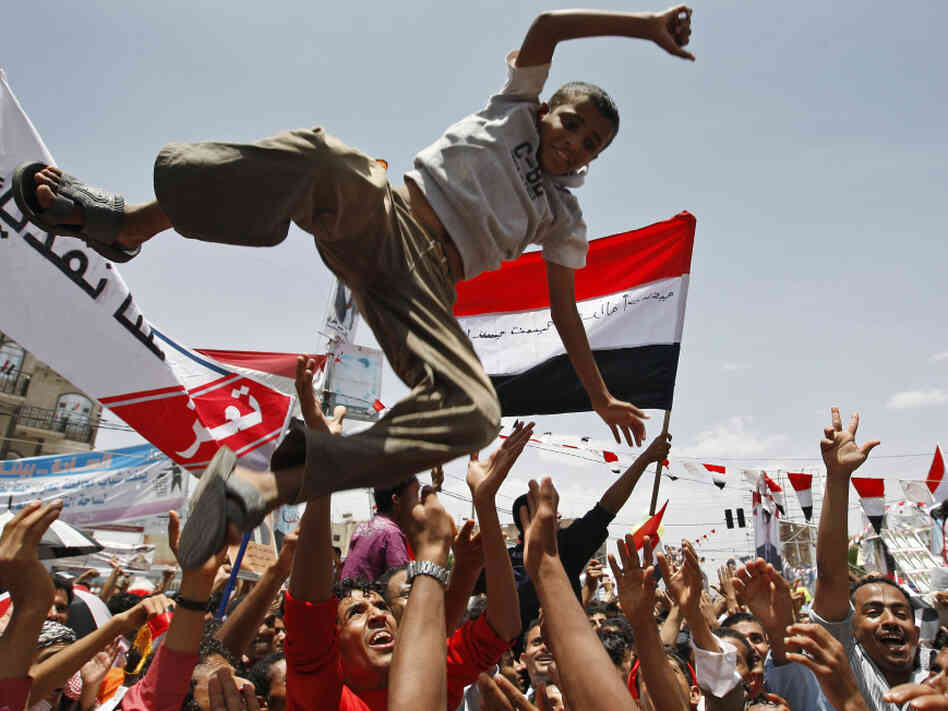 In the capital, Sanaa, on Sunday, some Yemeni anti-government protesters celebrated Saleh's departure.