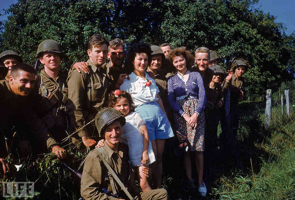 Throughout the battle of Normandy leading to the liberation of Paris, Scherschel also captured Allied troops with French citizens, as well as street celebrations and parades.
