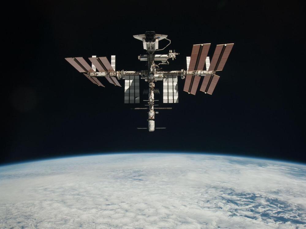 The International Space Station and the docked space shuttle Endeavour, flying at an altitude of approximately 220 miles, on May 23, 2011.